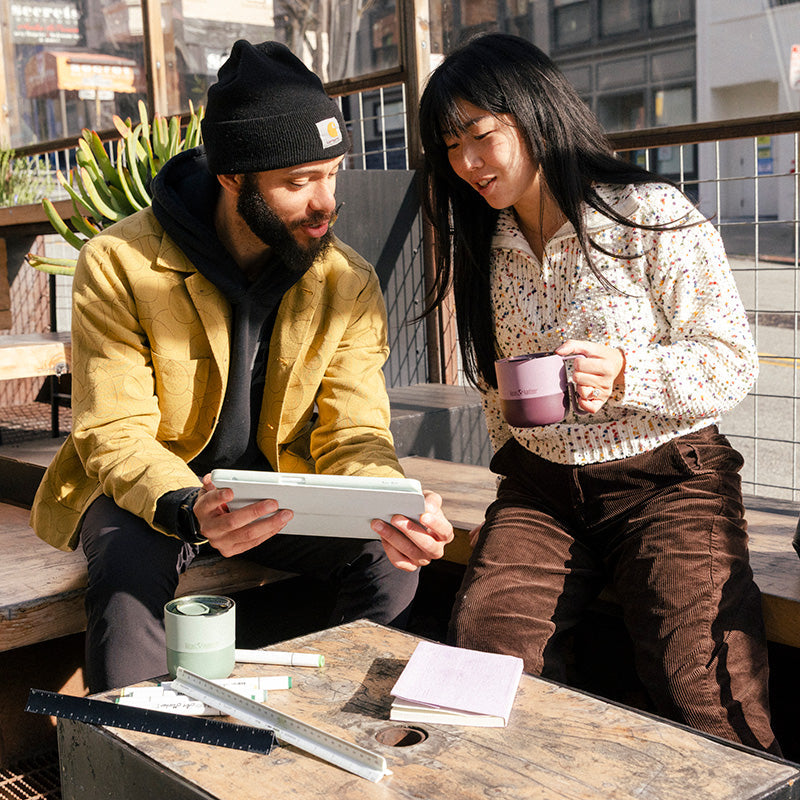 12oz-rise-mug-o5 12oz_rise_coffee_mug_dusty_orchid_couple_city_patio_square.jpg