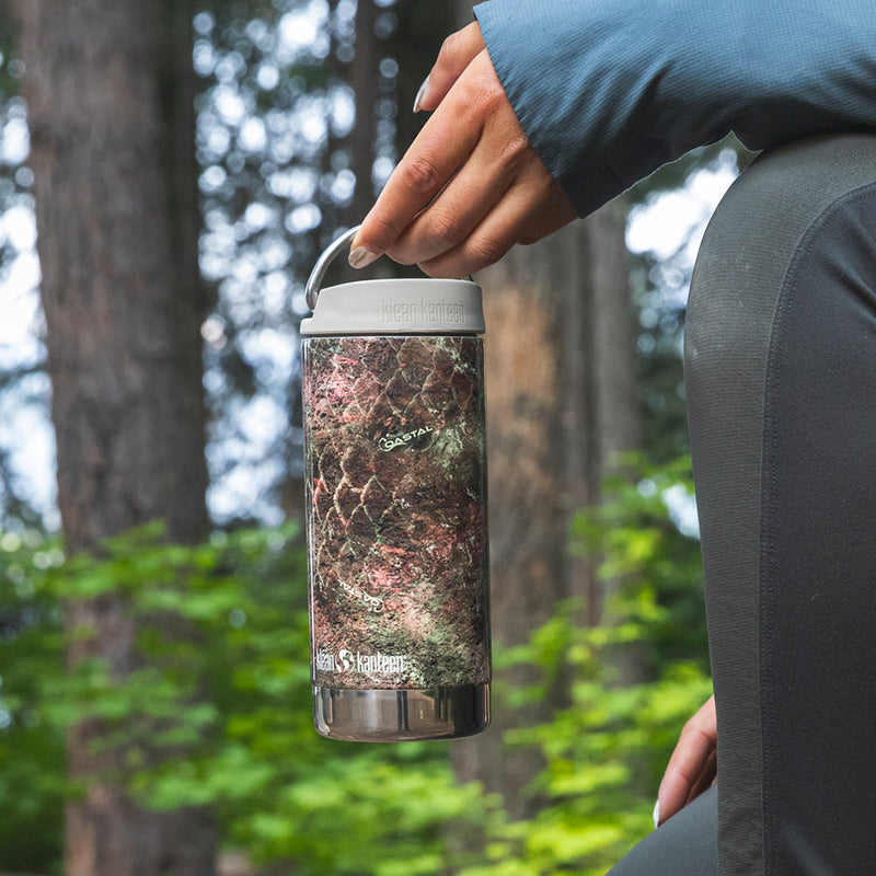 12oz-tkwide-with-twist-cap-mossy-oak-v1 12oz_tumbler_mossyoak_rainbowtrout_hand_closeup_square.jpg