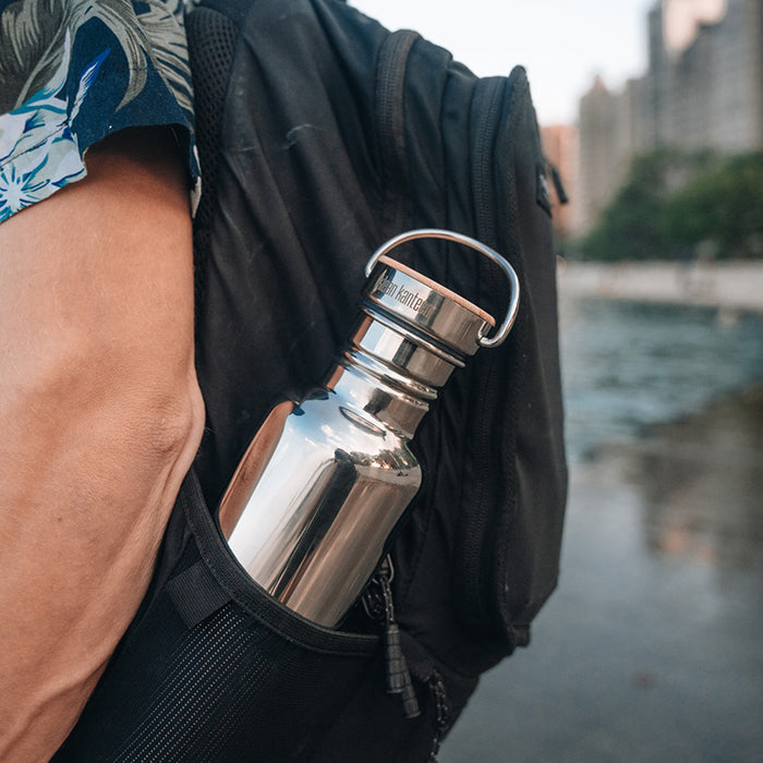 27oz-reflect-with-bamboo-cap-p7 K27SSLRF-MS-BAMBOO_reflect-bottle_backpack_lifestyle.jpg